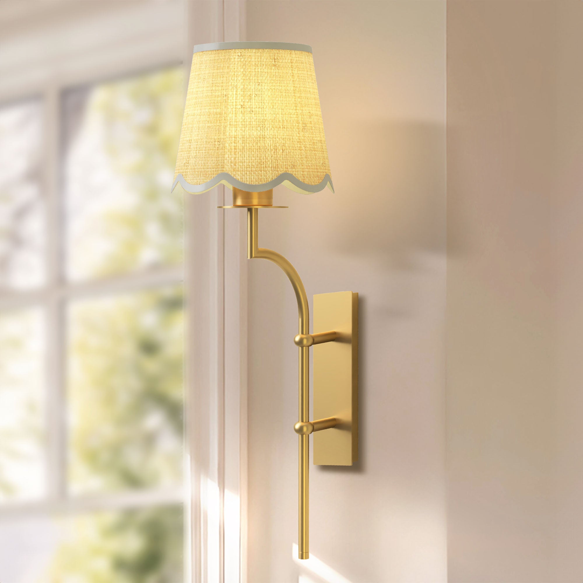 nala clamp rattan sconce for dining with a gold finish and fabric shade in a room with a window