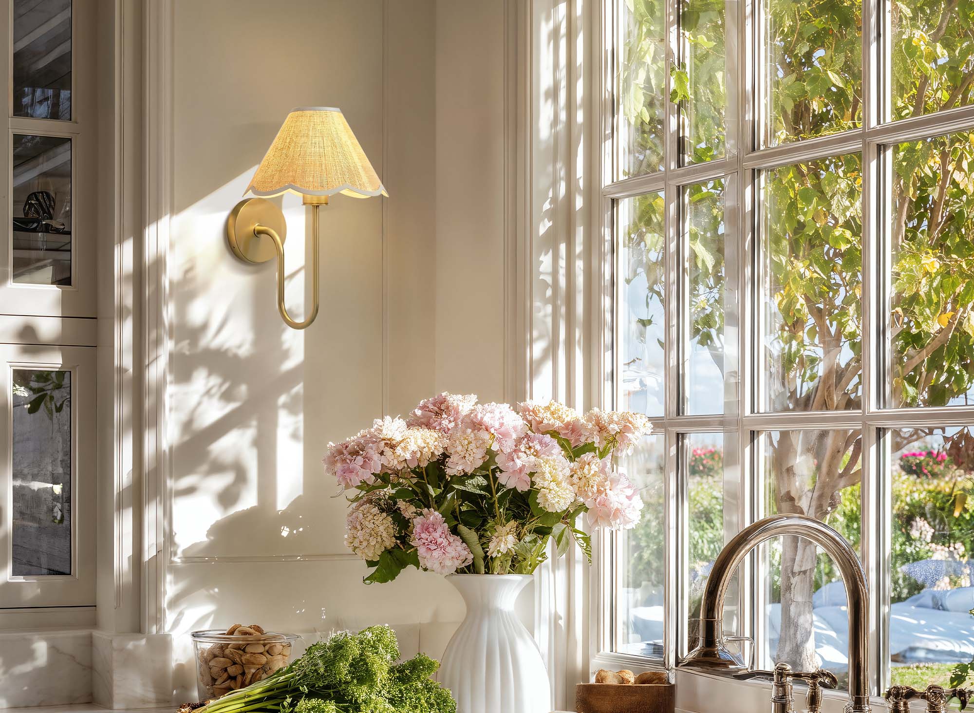spring lyra rattan sconce beside a bouquet of flowers on a windowsill