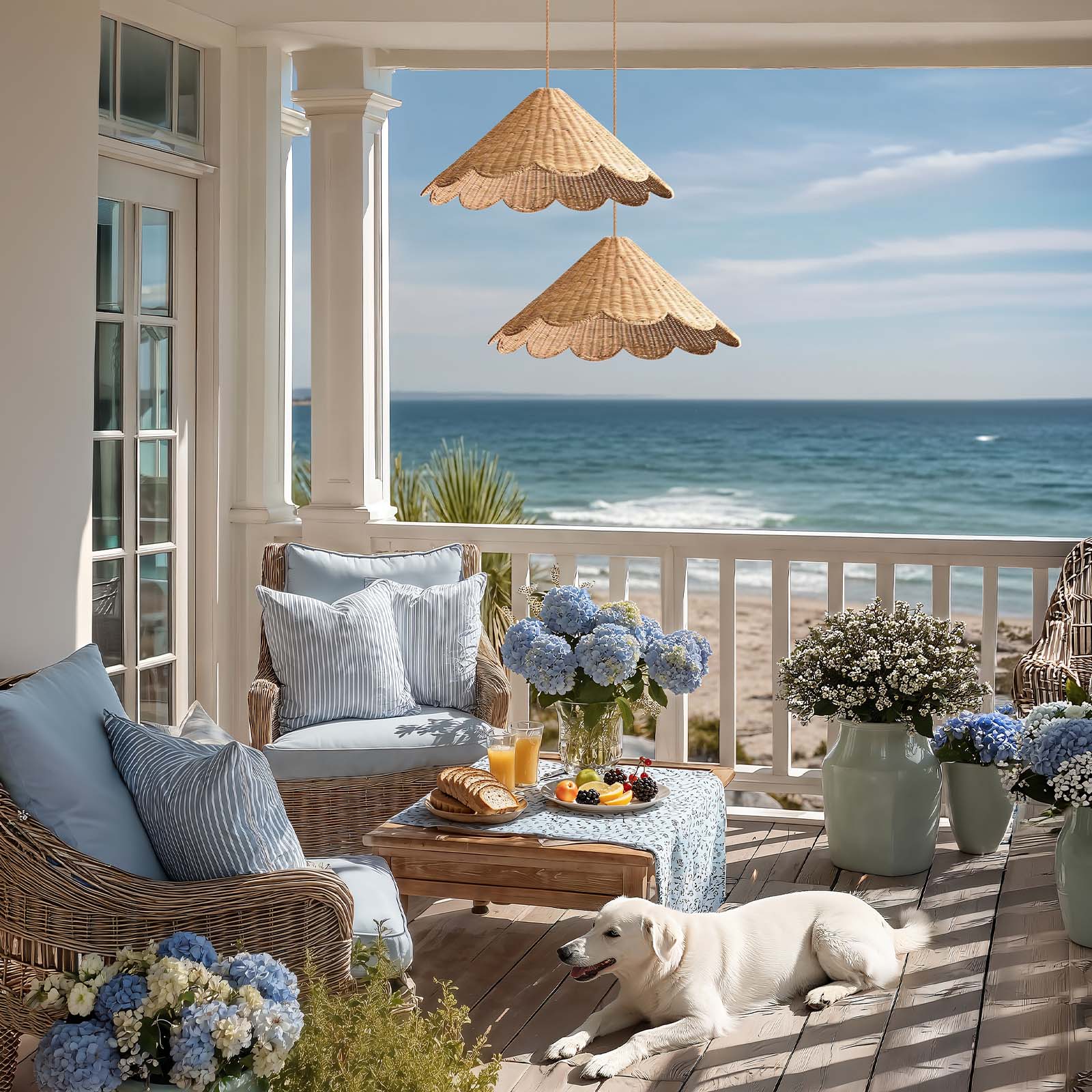 coastal outdoor daisy rattan pendant light in a cozy outdoor seating area with a view of the ocean