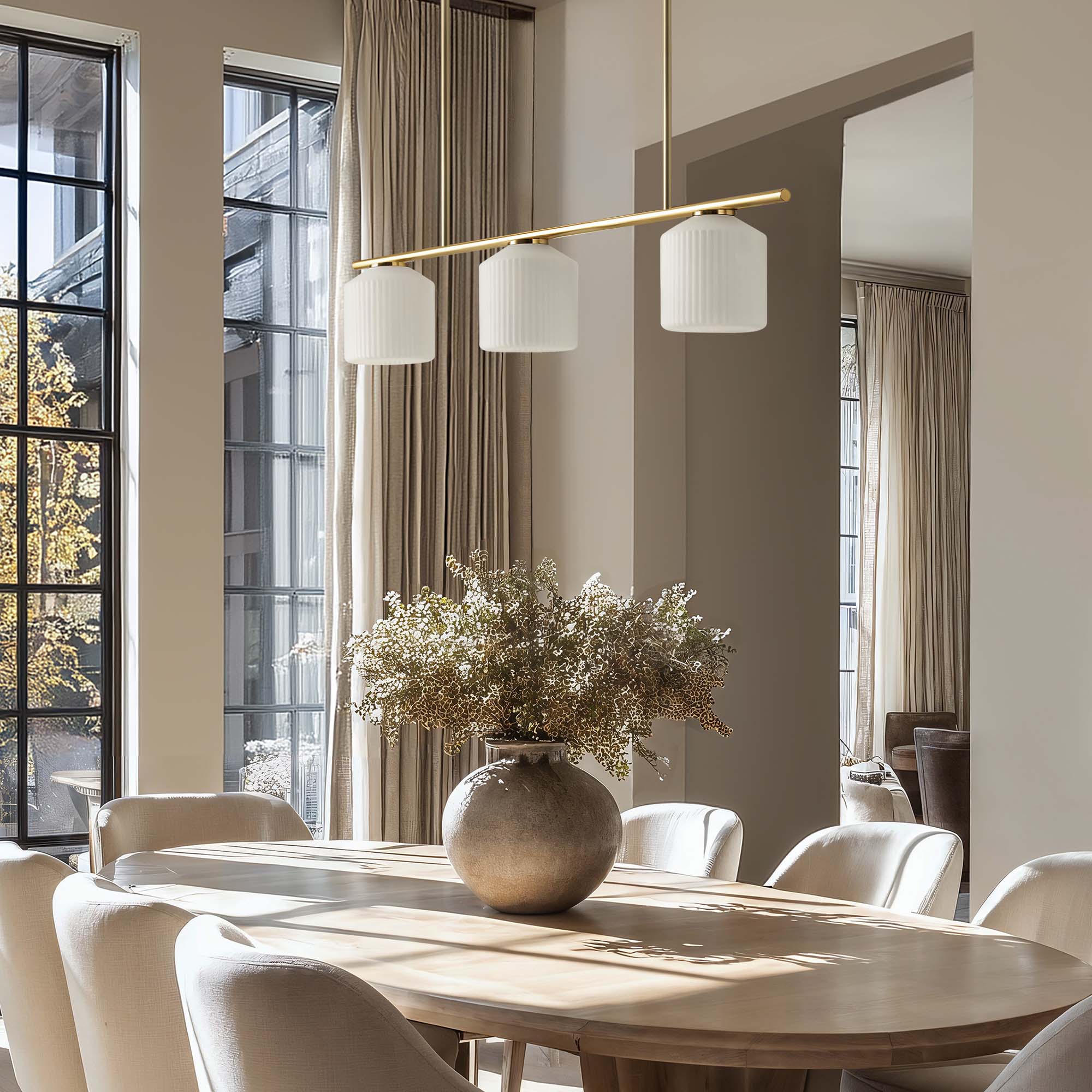 rowabi serene polished 3 light pendant light for dining room with a wooden table, chairs