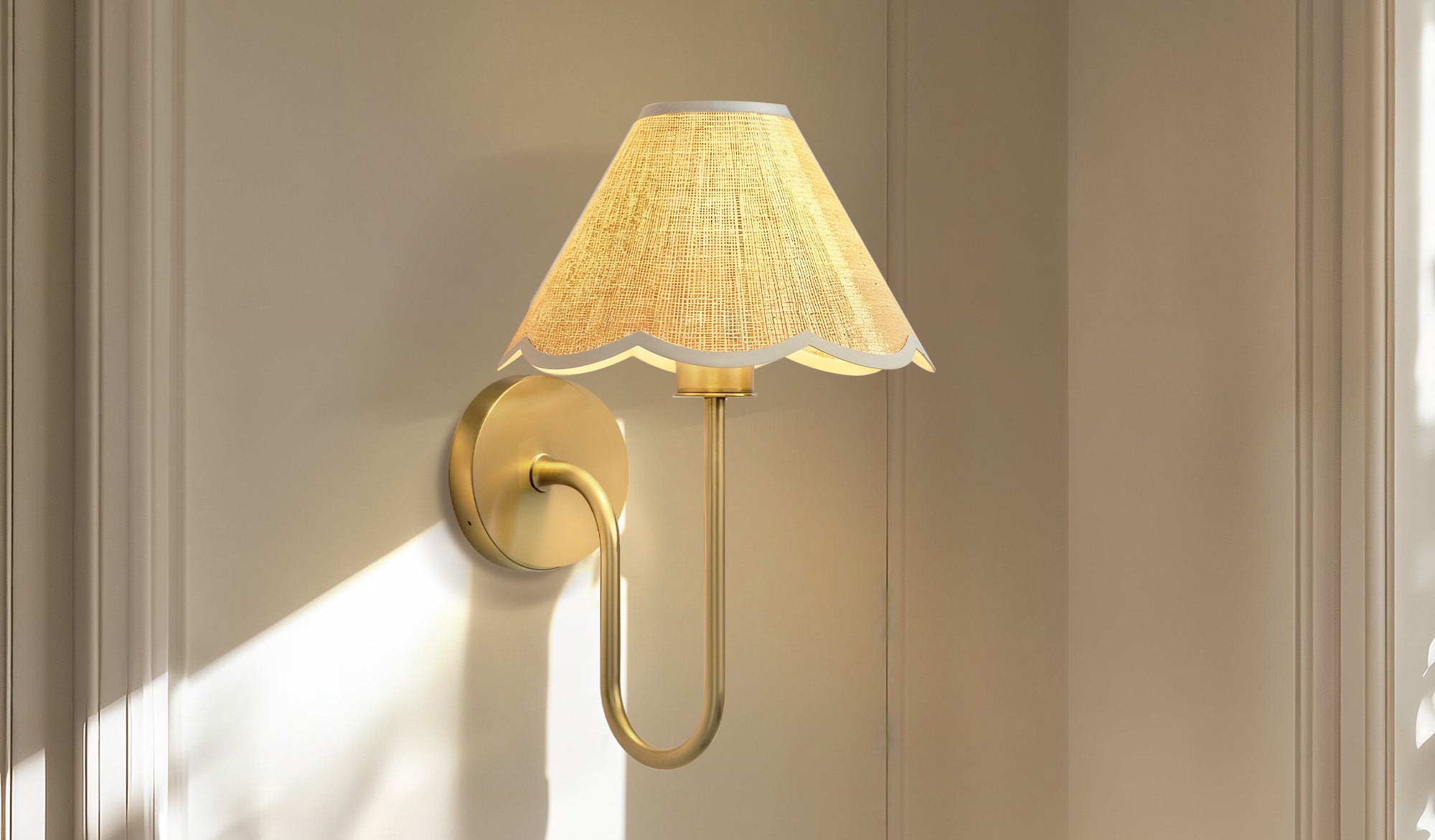 spring lyra rattan sconce focus on a wall-mounted lamp with a gold finish and scalloped lampshade